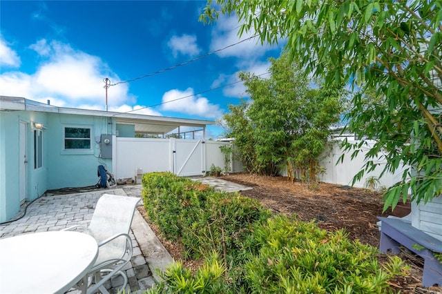 22062 Marshall Ave, Port Charlotte, FL 33952 - fenced backyard with a gate and a patio