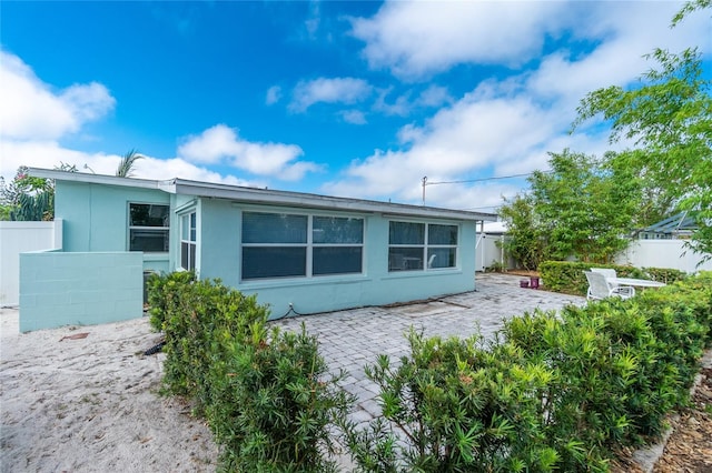 22062 Marshall Ave, Port Charlotte, FL 33952 - back of house featuring a patio area and stucco siding