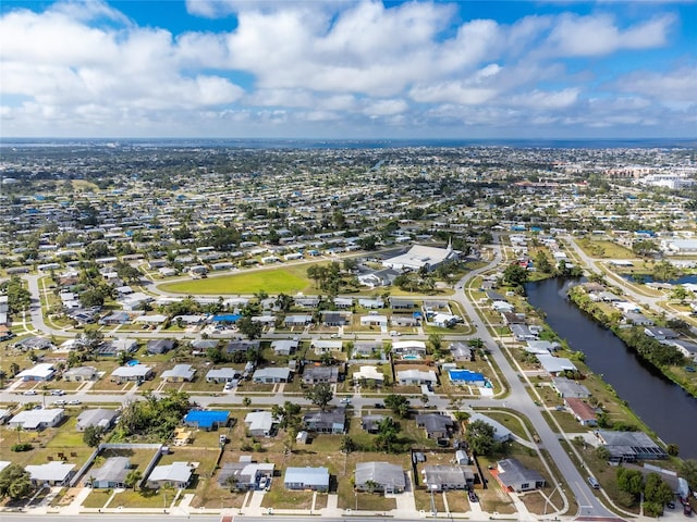22062 Marshall Ave, Port Charlotte, FL 33952 - aerial overview of property's location featuring a large body of water and nearby suburban area