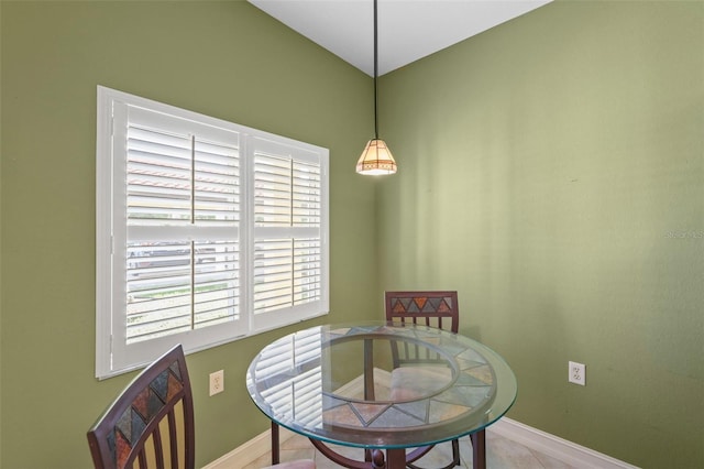 dining area with light tile patterned floors and a wealth of natural light