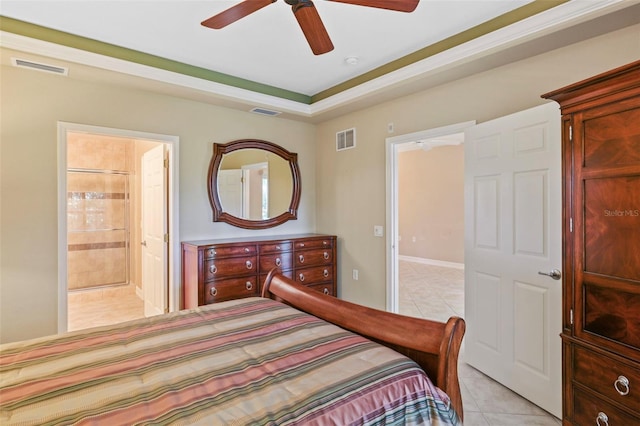 bedroom featuring ensuite bathroom, ceiling fan, and light tile patterned floors