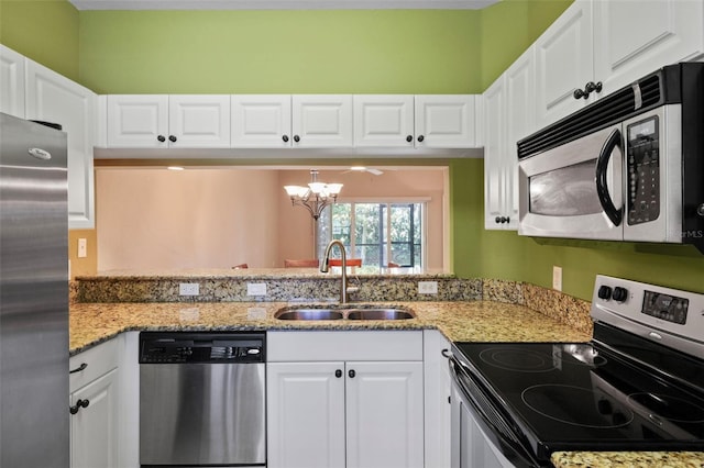 kitchen featuring white cabinets, appliances with stainless steel finishes, and sink