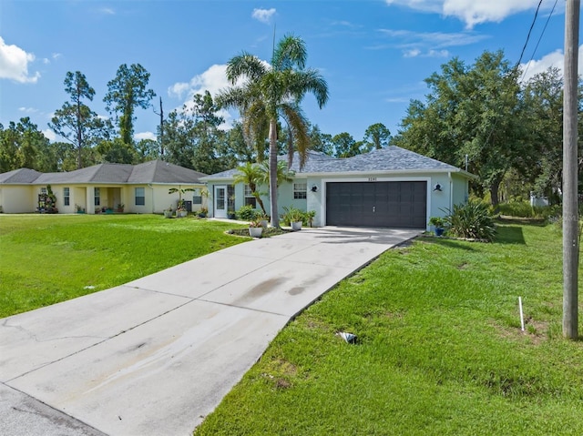 ranch-style home featuring a front yard and a garage