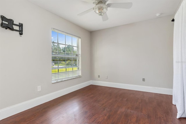 unfurnished room featuring ceiling fan and dark hardwood / wood-style flooring