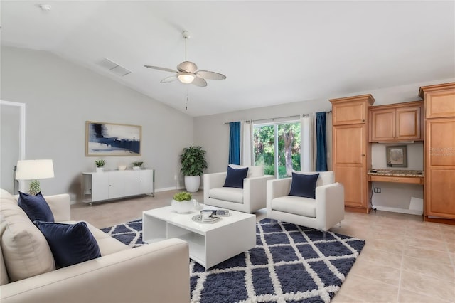 living room featuring vaulted ceiling, built in desk, ceiling fan, and light tile patterned floors