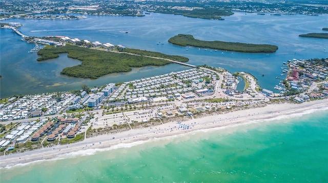 drone / aerial view featuring a water view and a view of the beach