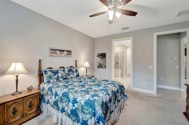 carpeted bedroom with ceiling fan and ensuite bath