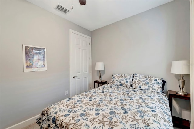 bedroom featuring ceiling fan and carpet