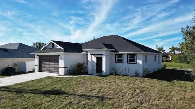 view of front of property with a front lawn and a garage