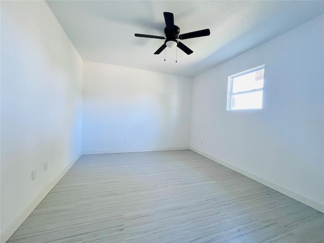 spare room with ceiling fan