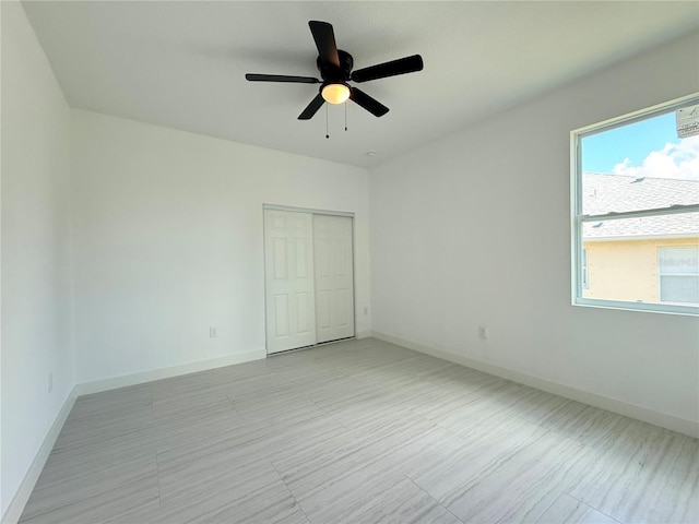 26345 Trinilas Dr, Punta Gorda, FL 33983 - unfurnished bedroom featuring baseboards, ceiling fan, and a closet