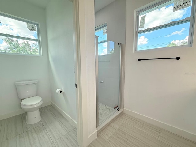 26345 Trinilas Dr, Punta Gorda, FL 33983 - bathroom with baseboards, toilet, and a stall shower