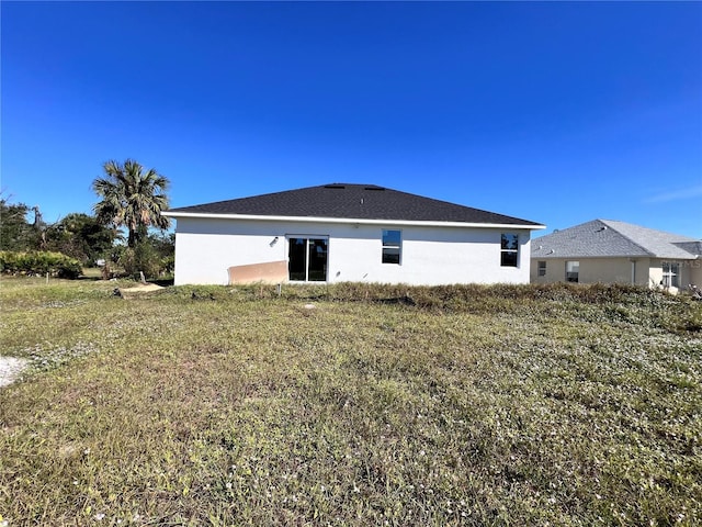 26345 Trinilas Dr, Punta Gorda, FL 33983 - rear view of house with stucco siding