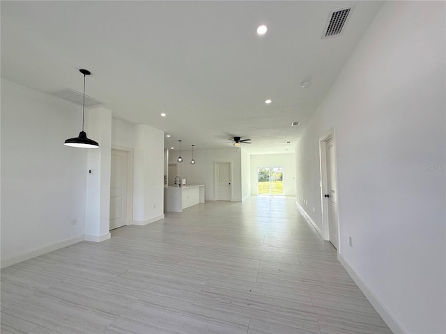 26345 Trinilas Dr, Punta Gorda, FL 33983 - interior space featuring recessed lighting, baseboards, a sink, ceiling fan, and visible vents