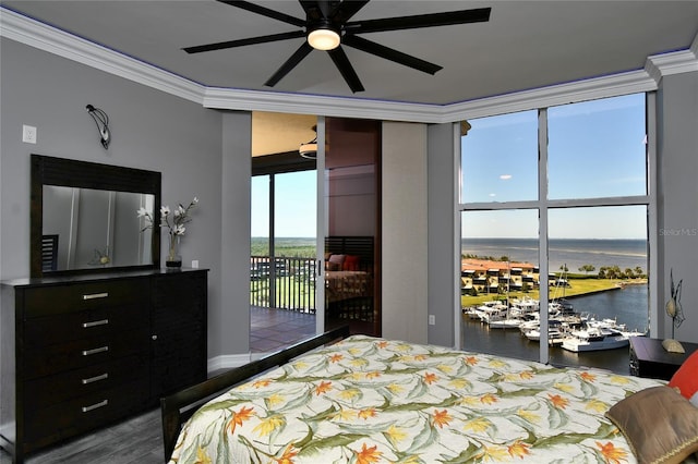 bedroom with a water view, ornamental molding, ceiling fan, access to exterior, and hardwood / wood-style floors