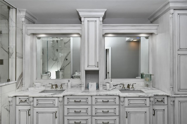 bathroom featuring decorative columns, vanity, and walk in shower