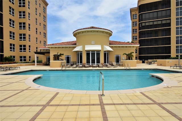 view of swimming pool with a patio