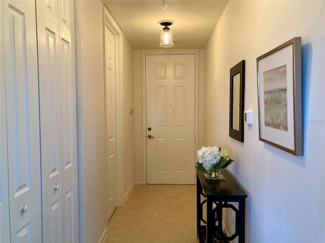 hallway featuring light tile patterned floors