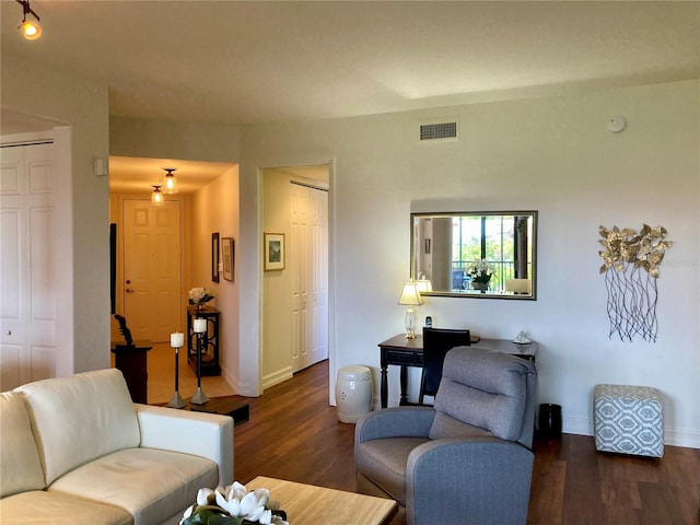 living room with dark hardwood / wood-style flooring