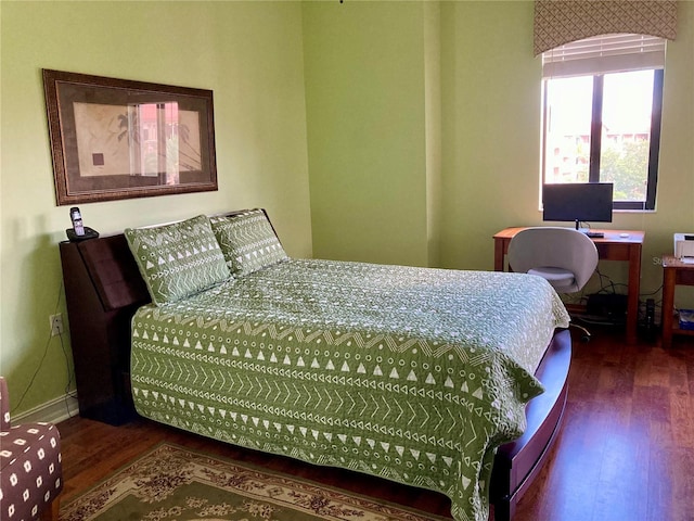 bedroom featuring dark hardwood / wood-style floors