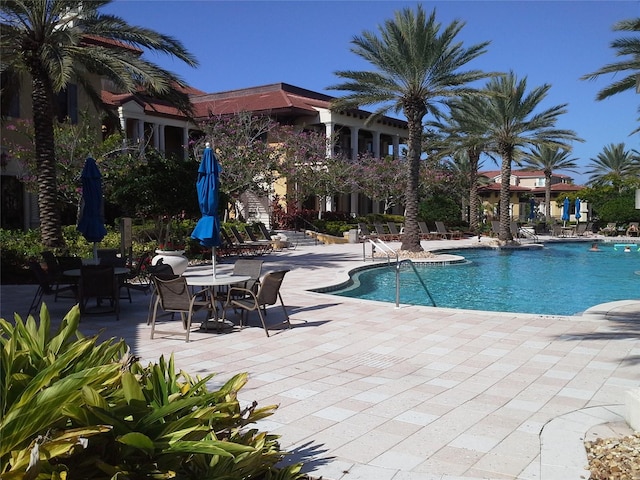 view of swimming pool featuring a patio area