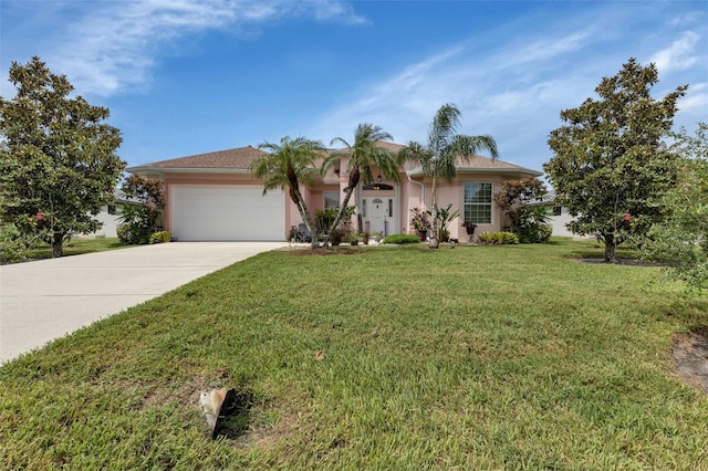 view of front of property with a garage and a front yard