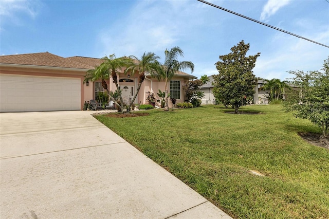 view of front of house with a garage and a front yard