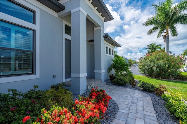 property entrance featuring a patio area