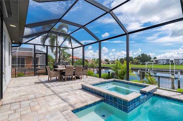 view of pool with a lanai, a patio area, an in ground hot tub, and a water view