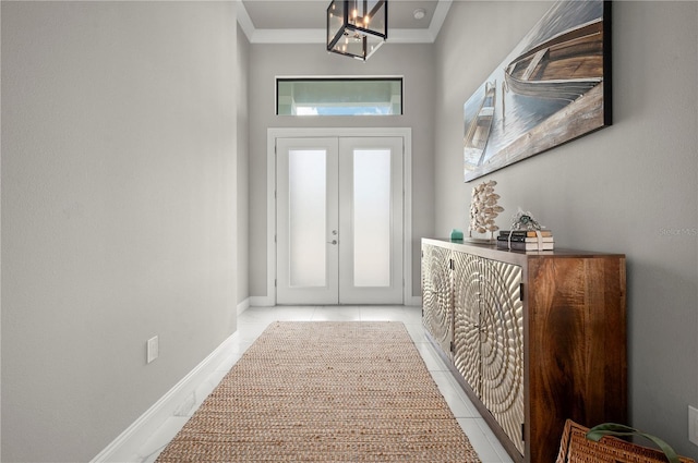 entryway featuring plenty of natural light, ornamental molding, and light tile patterned floors