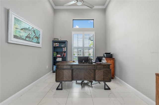 office area featuring a towering ceiling and ceiling fan