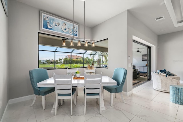 dining area with ceiling fan