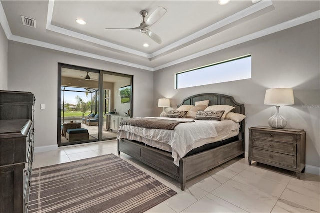 bedroom with a raised ceiling, ceiling fan, access to exterior, and multiple windows