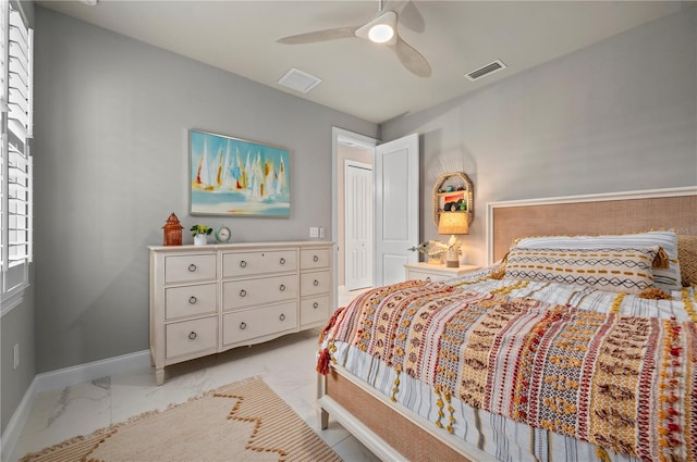 bedroom featuring ceiling fan and a closet