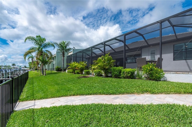 view of yard featuring glass enclosure