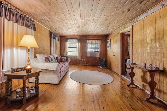 living room with wood-type flooring, wood ceiling, and wood walls