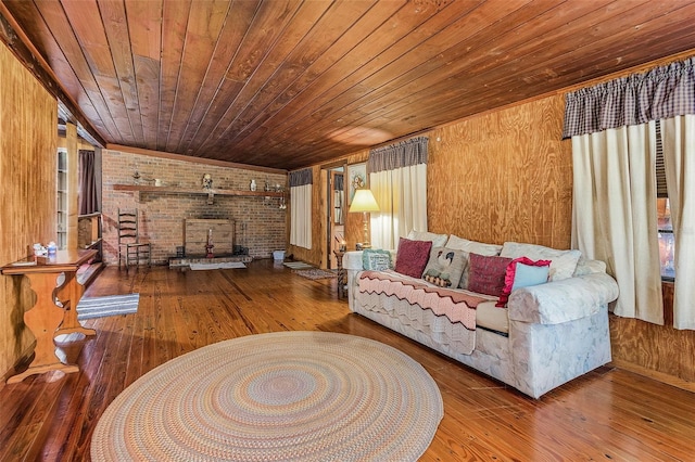 living room with brick wall, wood walls, hardwood / wood-style floors, and wood ceiling