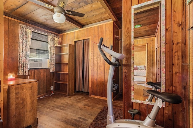 interior space with wooden ceiling, ceiling fan, wood walls, and hardwood / wood-style floors