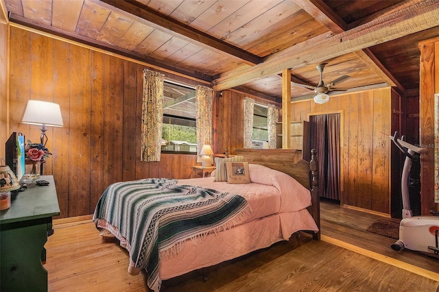 bedroom with wood walls, hardwood / wood-style floors, and wooden ceiling