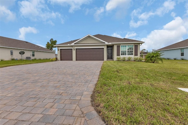 single story home with a front yard and a garage