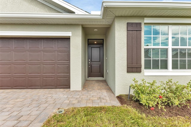 doorway to property featuring a garage