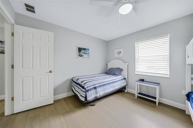 bedroom featuring ceiling fan and light hardwood / wood-style flooring