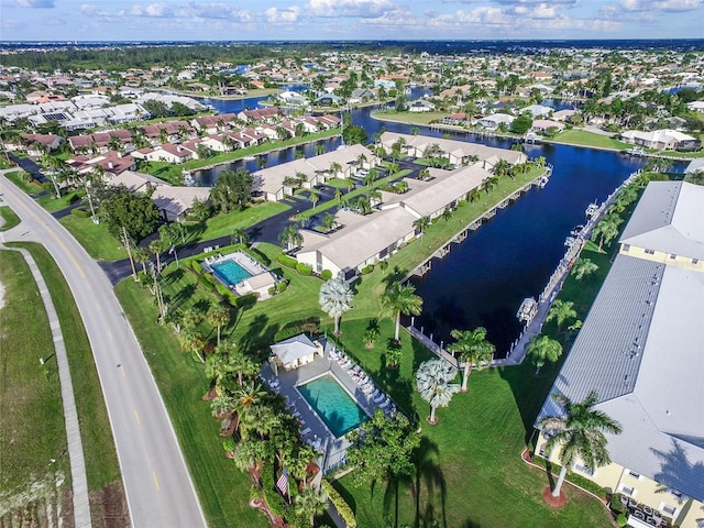 birds eye view of property with a water view