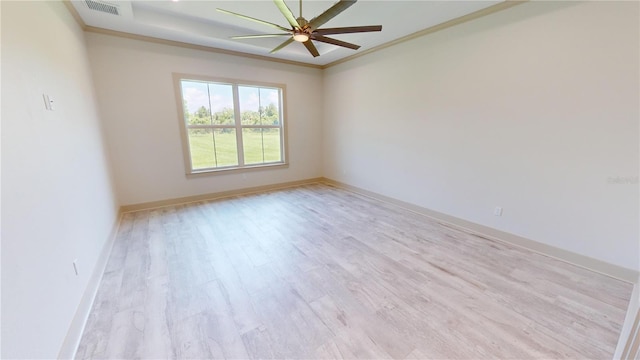 empty room with ceiling fan, ornamental molding, and light hardwood / wood-style floors