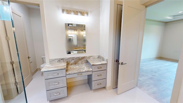 bathroom featuring toilet and vanity