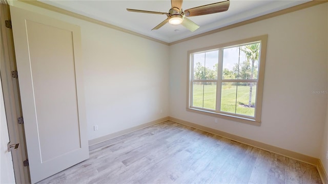 spare room with ceiling fan, ornamental molding, and light hardwood / wood-style floors