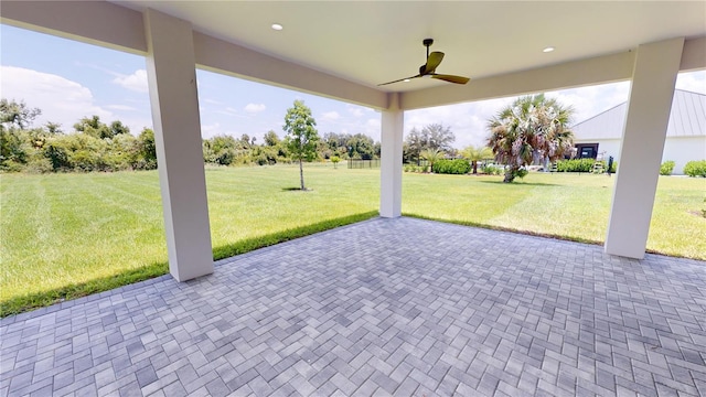 view of patio featuring ceiling fan