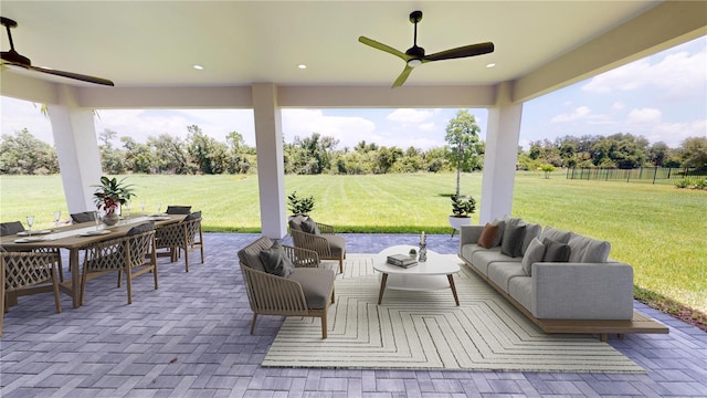 view of patio with ceiling fan and an outdoor living space