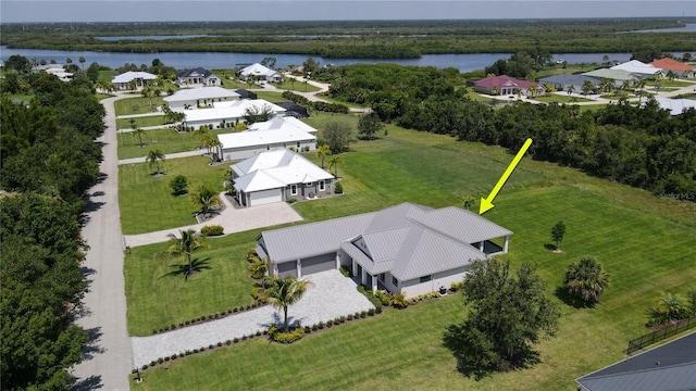 birds eye view of property with a water view