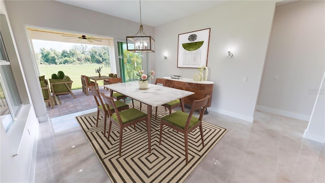 dining area with ceiling fan with notable chandelier